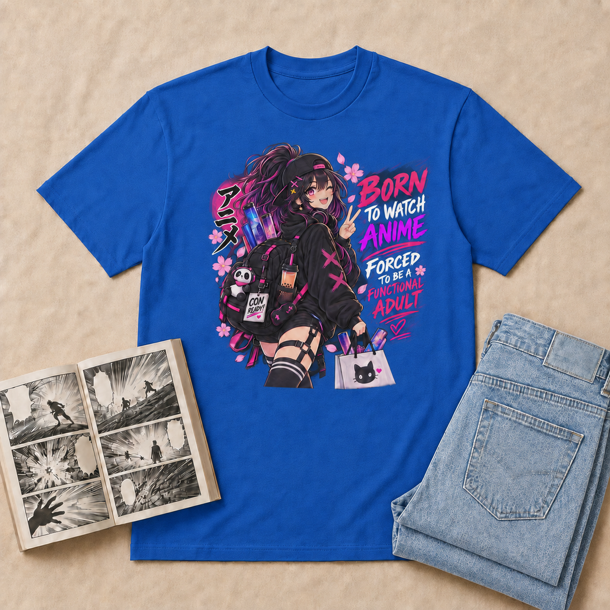 Born to Watch Anime Girl T-Shirt — Royal flat-lay with light-blue double-folded jeans and manga