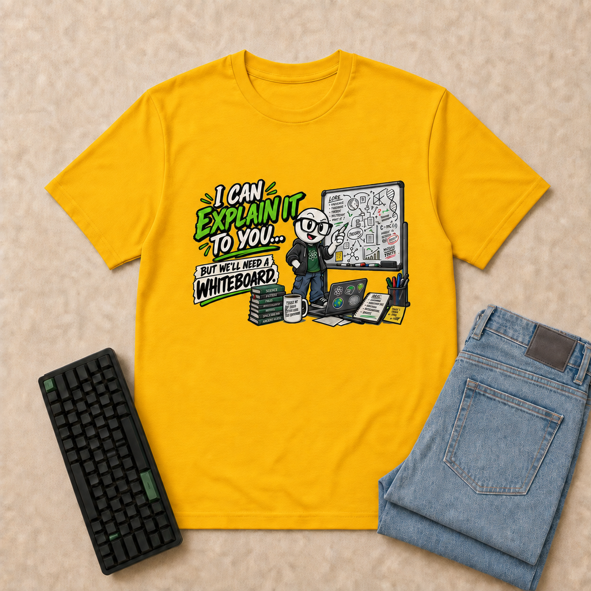 I Can Explain It Nerd Life T-Shirt — Gold overhead flat-lay with keyboard and double-folded jeans
