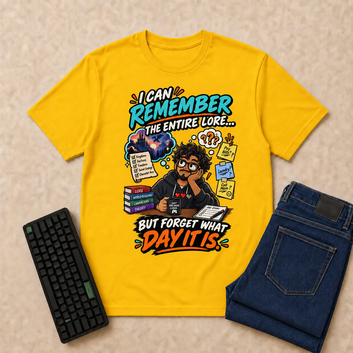 I Can Remember Nerd Life T-Shirt — Gold overhead flat-lay with keyboard and double-folded jeans